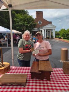 two people at the depot street farmers market